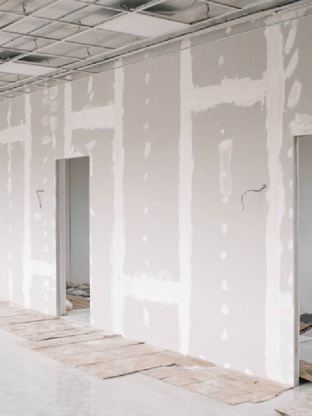 Plasterboard walls installed in a commercial interior ready for finishing