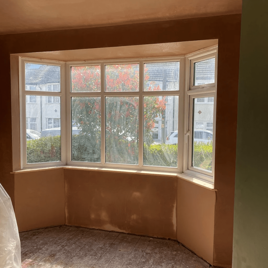Plastered bay window reveals and walls in a residential property