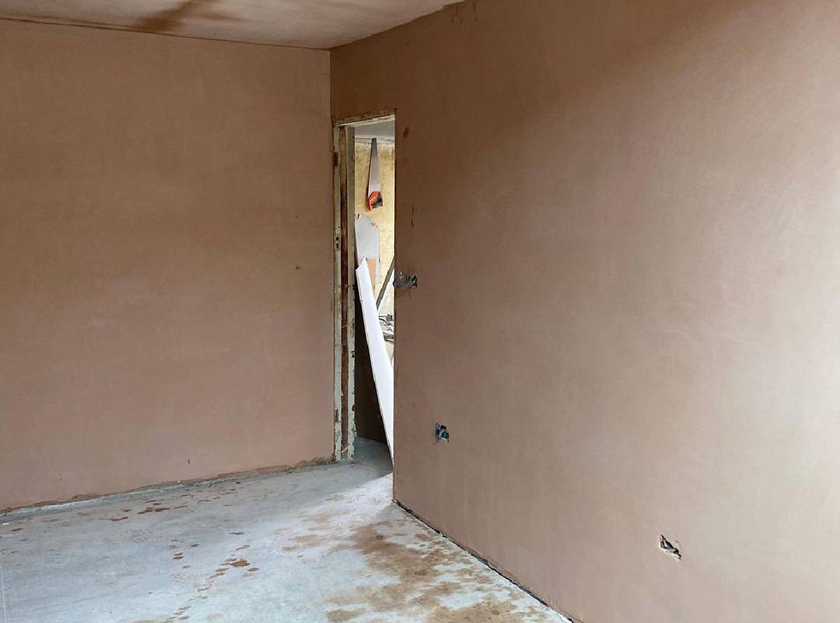 Freshly plastered interior walls with a smooth professional finish