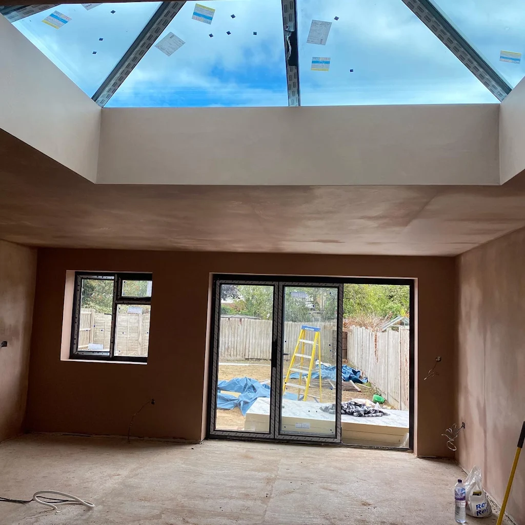 Interior room plastering with skylights and patio doors